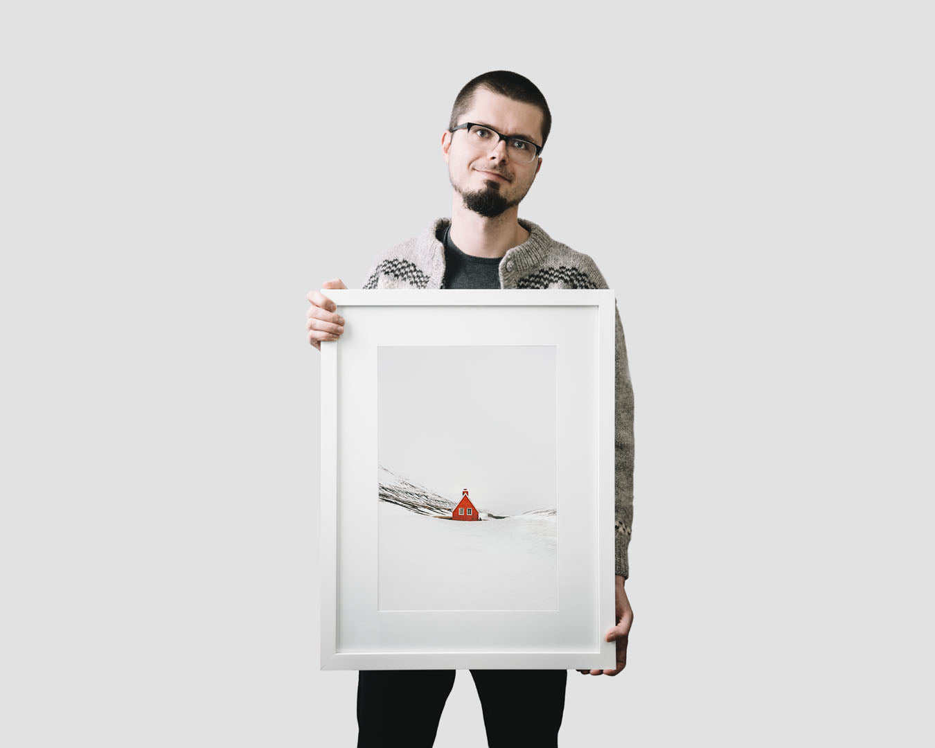 Nordic travel photography print featuring a lonely red cabin in the mountains in winter, Iceland