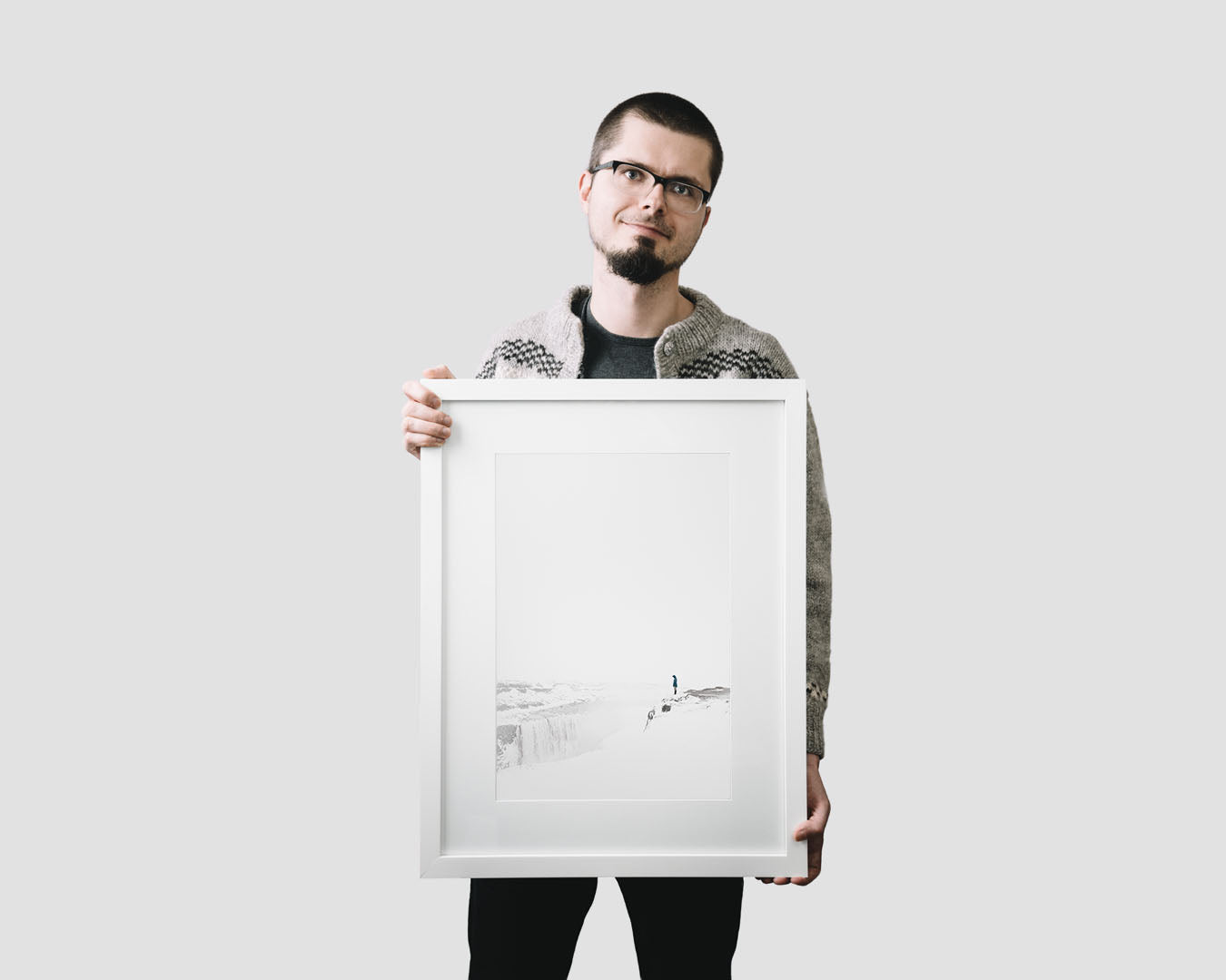 Nordic travel photography print featuring a lonely hiker by the waterfall of Dettifoss in winter, Iceland